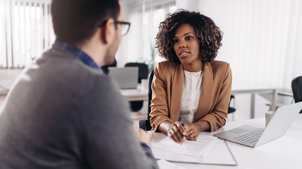 A women and a man sitting down talking